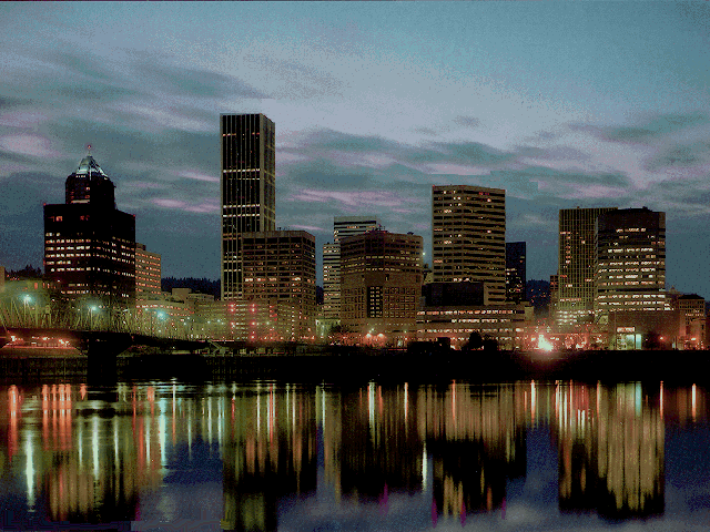 Portland city skyline at night，reflected in the river